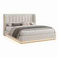 Letto matrimoniale imbottito in tessuto beige con testiera alta e profili dorati, per materasso 180 x 200 cm, 220 x 230 x 130 cm